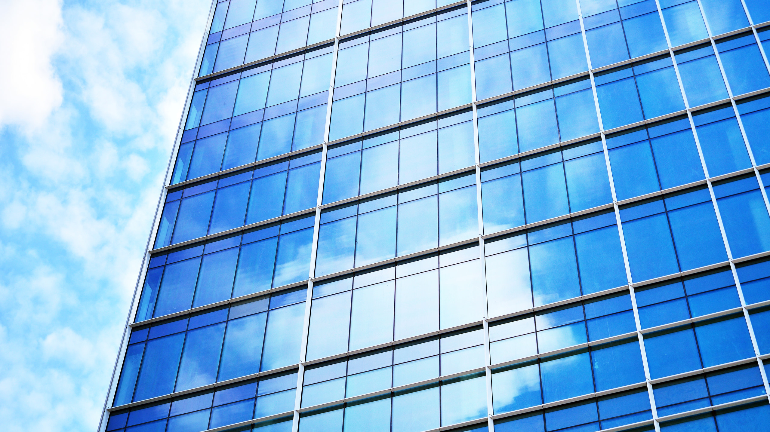 Modern blue glass facade at Cyber Works